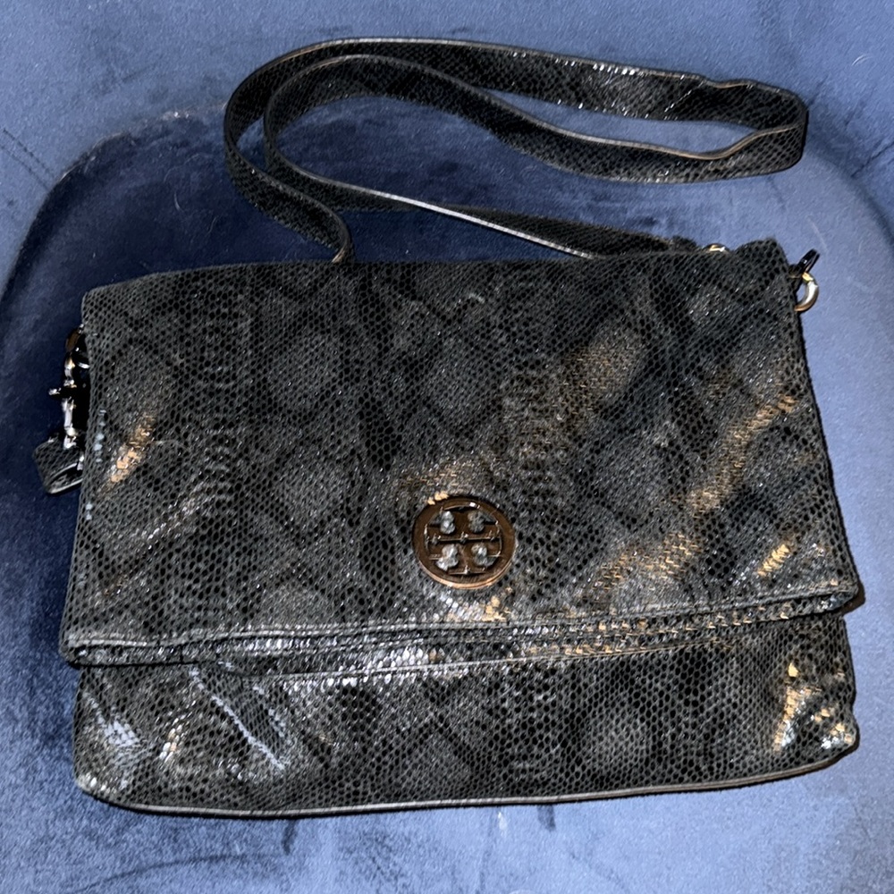 Tory Burch Black snake pattern crossbody bag. Used twice. Magnetic closure.